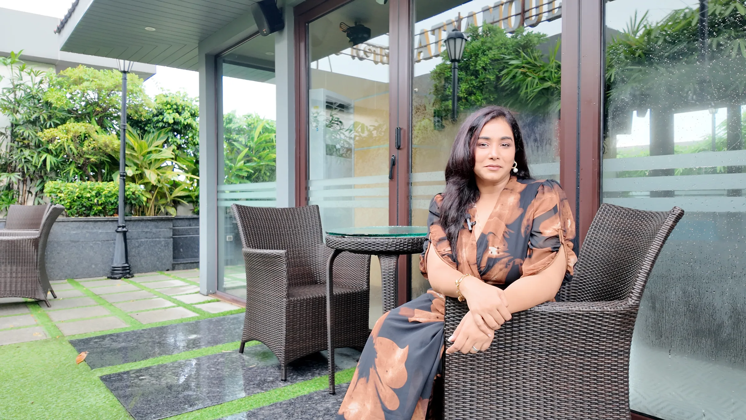 Sneha seated outdoors after the rain