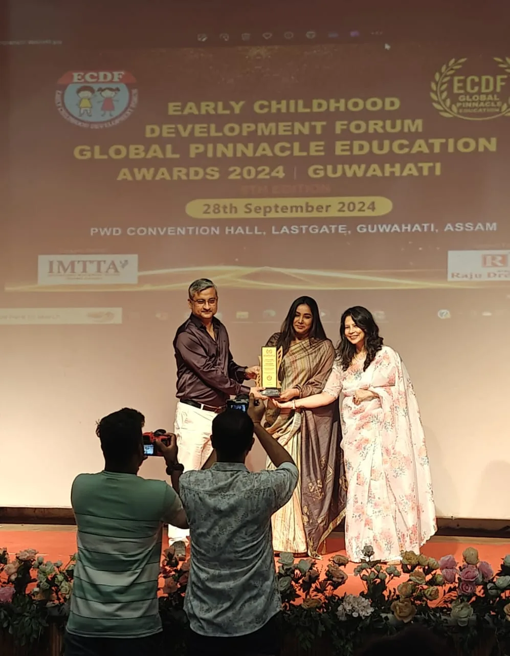 Sneha receiving an award at the Global Pinnacle Education Awards 2024 in Guwahati